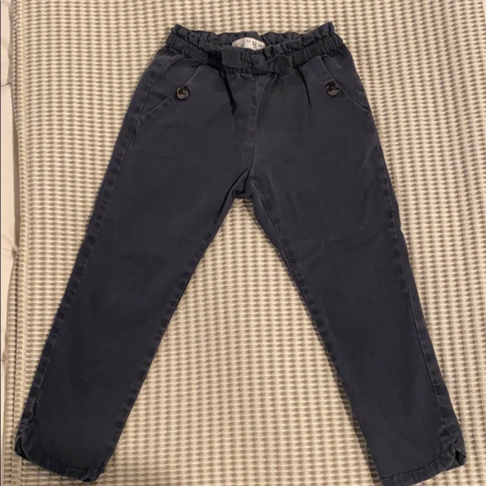 Dark blue Zara pants with corduroy bow detail.